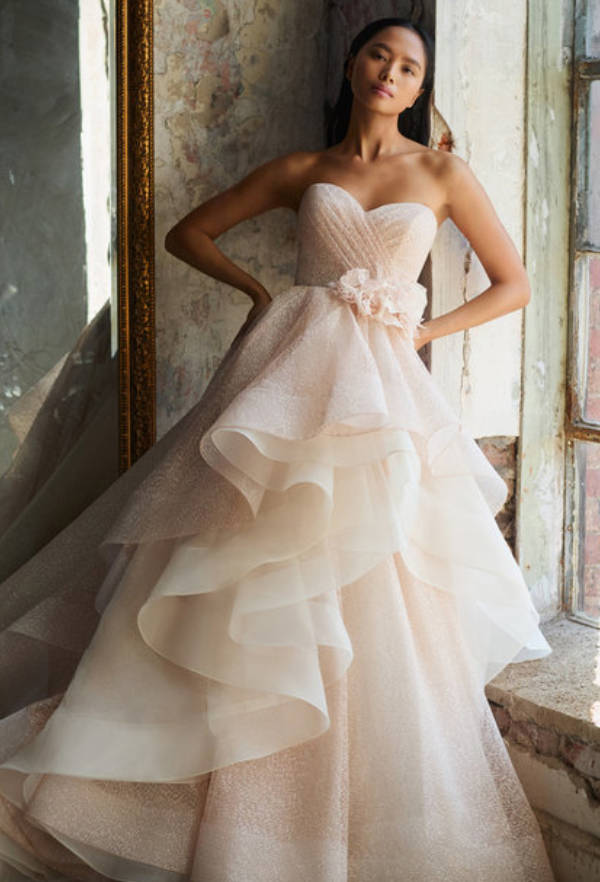 Model wearing a white gown by Lazaro