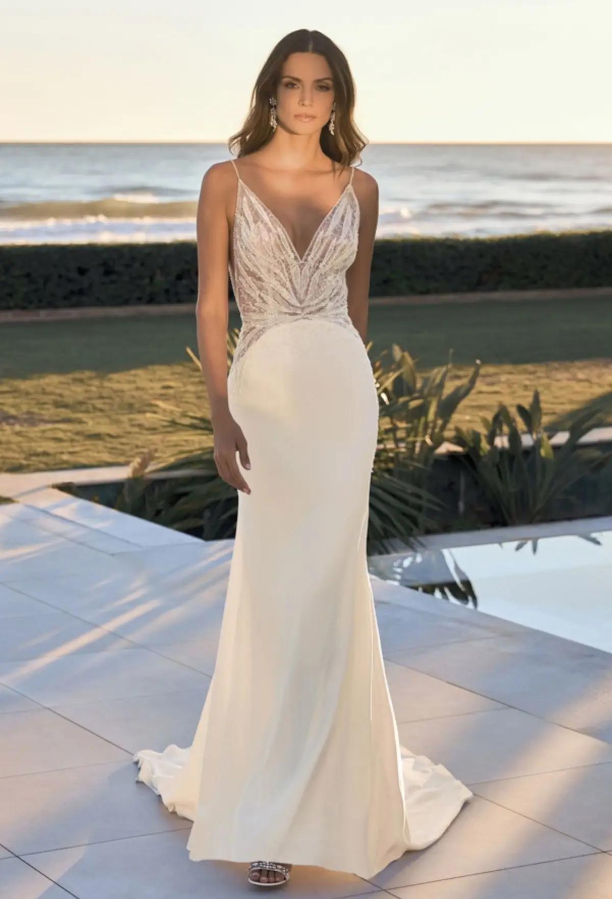 Model wearing a white gown by Pronovias
