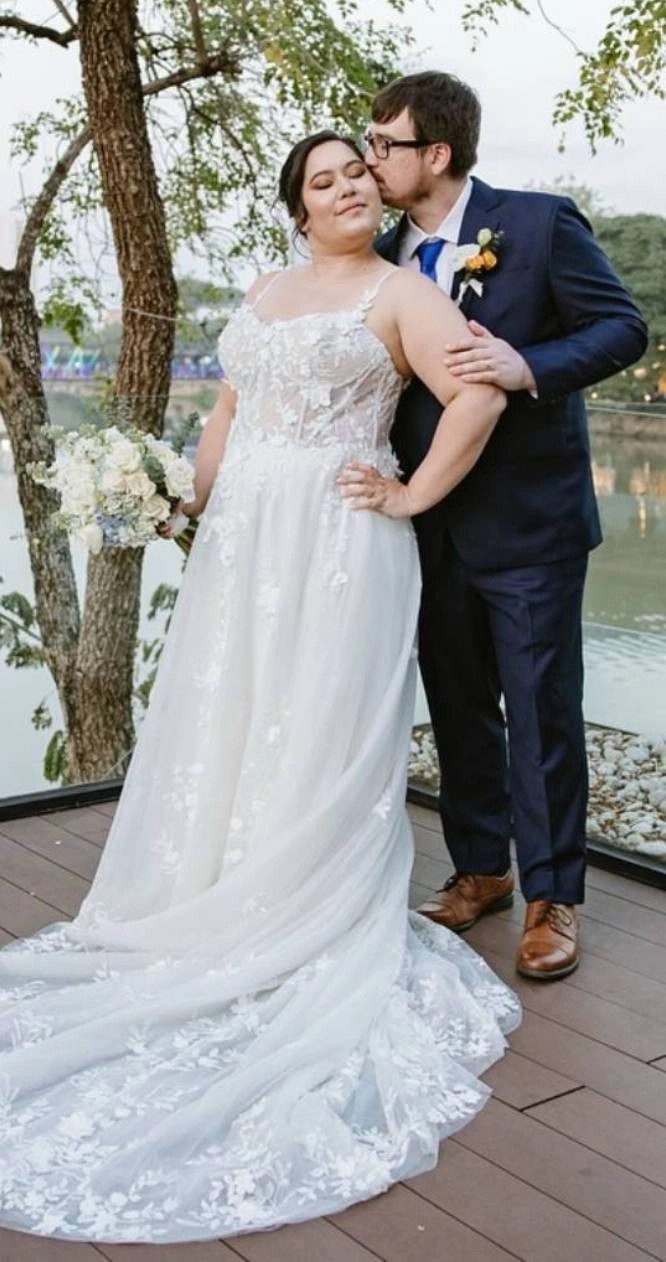 Couple wearing a white gown and navy suit