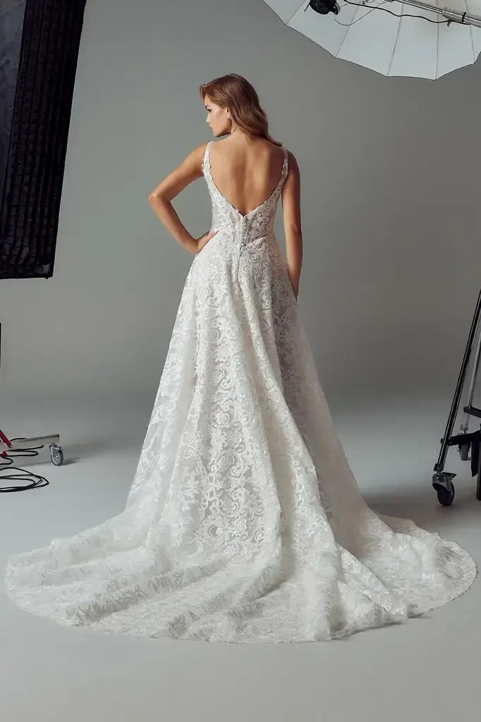 model is wearing a sleeveless a-line bridal gown