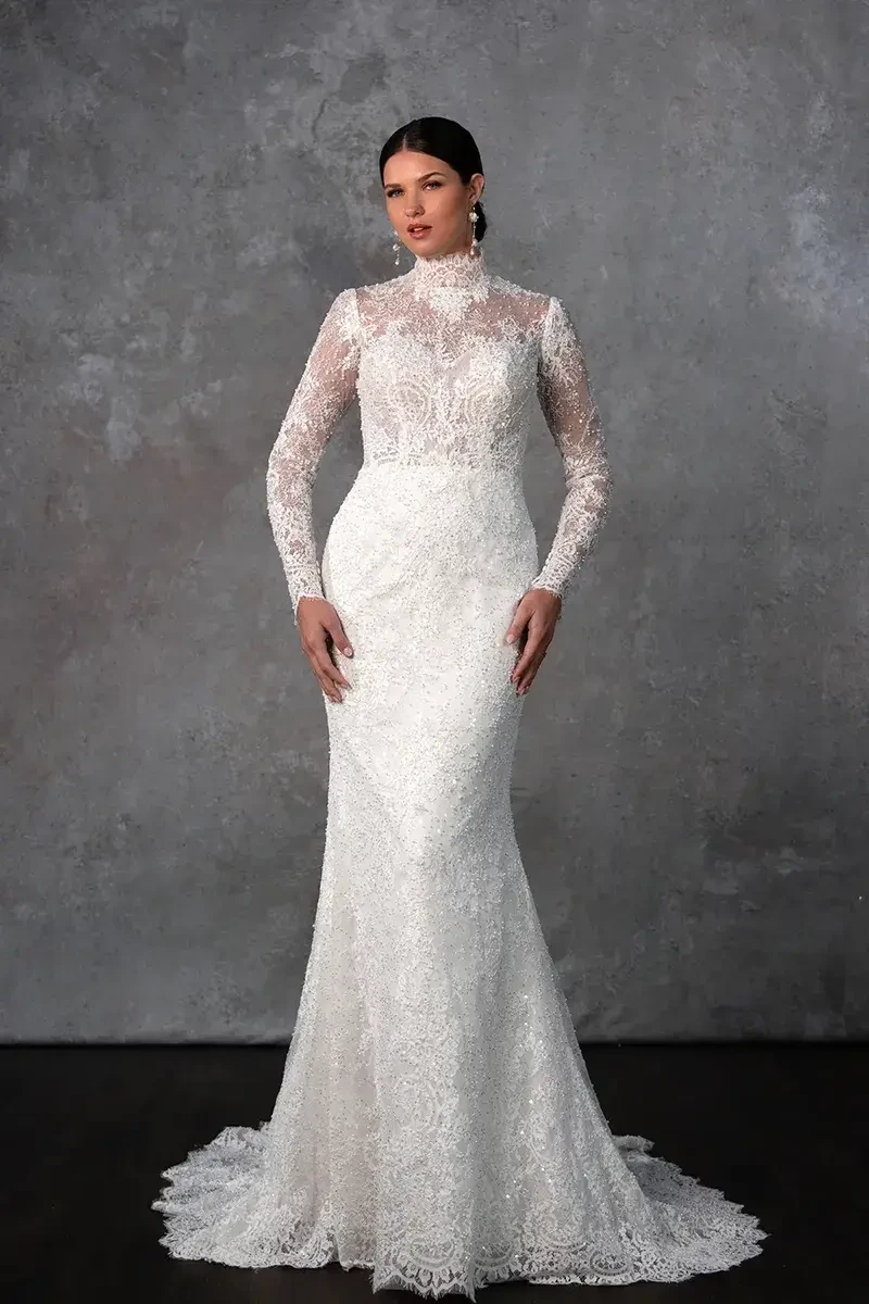 model is wearing a high neck long sleeve lace wedding dress