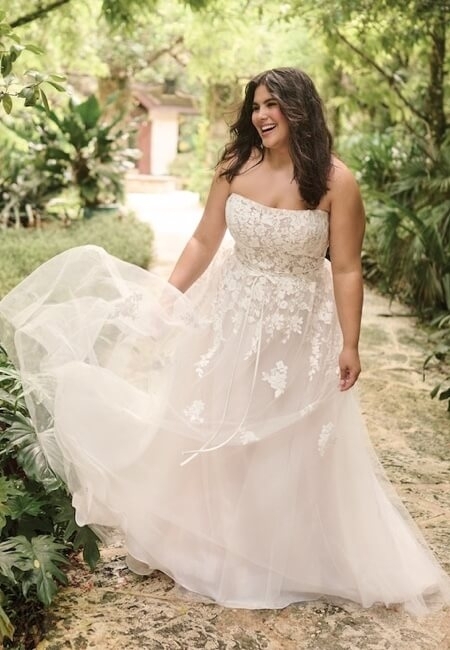 Model wearing a white gown by Maggie Sottero