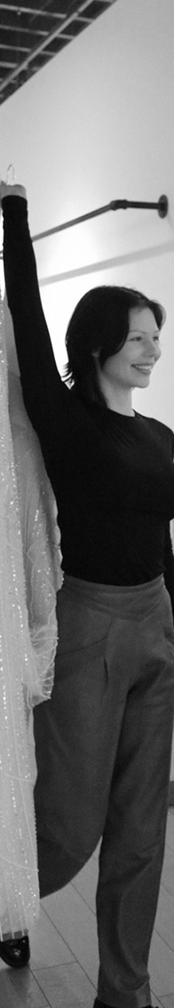 Photo of the model holding a gown - Mobile Image