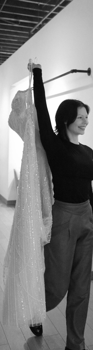 Photo of the model holding a gown