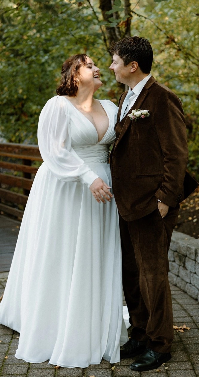 Couple wearing white gown and brown suit