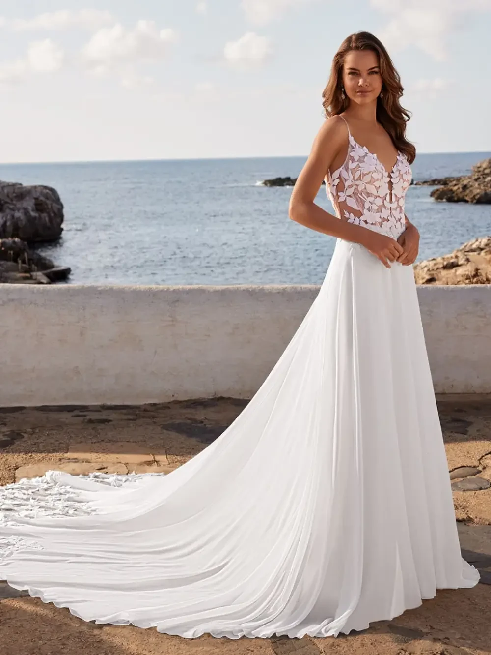Model wearing a white gown by Enzoani