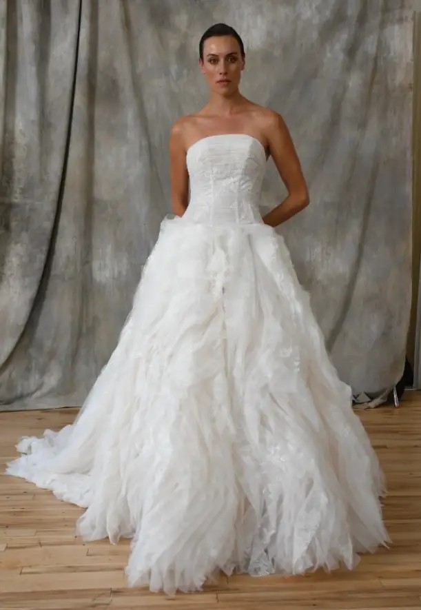 Model wearing a white gown by Ines by Ines Di Santo