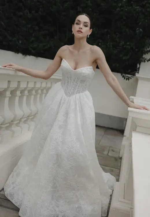 Model wearing a white gown by Jessica Couture