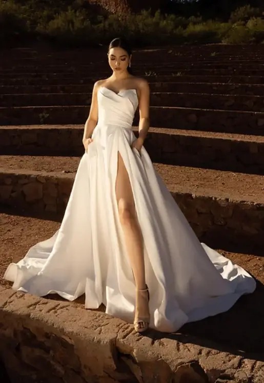 Model wearing a white gown by JH Bridal By Jimme Huang