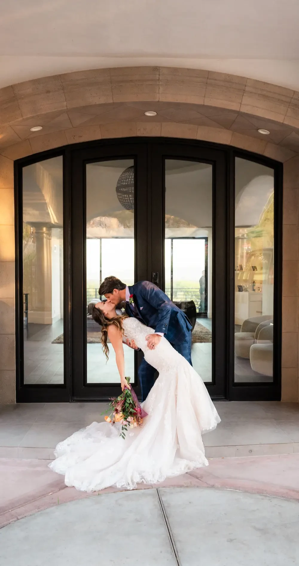 Couple wearing white gown and white suit
