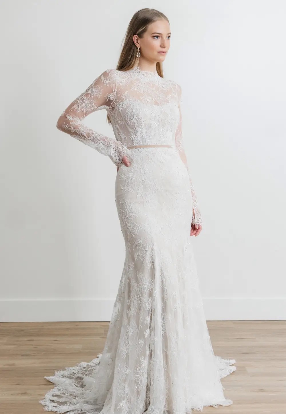 Model wearing a white gown by Watters