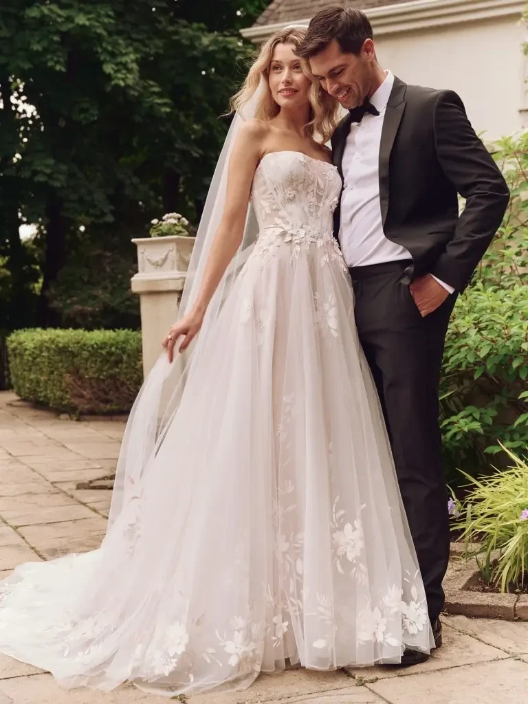 model is wearing a romantic wedding dress